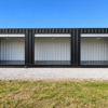 40ft High Cube Shipping Container with Three Roll-Up Doors in Black – One-Trip